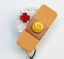 Load image into Gallery viewer, Smiling Nurses Band Aid Retractable ID Badge Reel